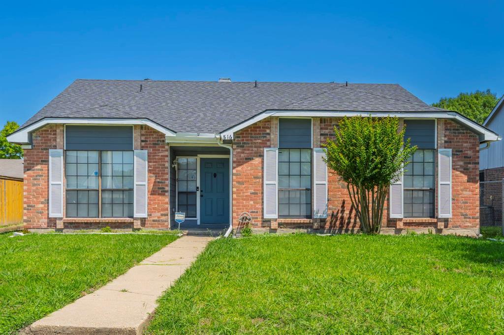 front view of a house with a yard