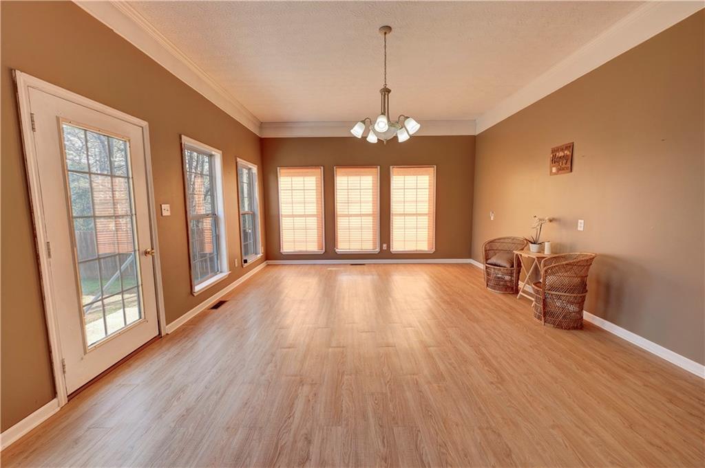 960 McEntyre Loop Calhoun, GA 30701 - Photo 26 of 77 a view of empty room with wooden floor and fan