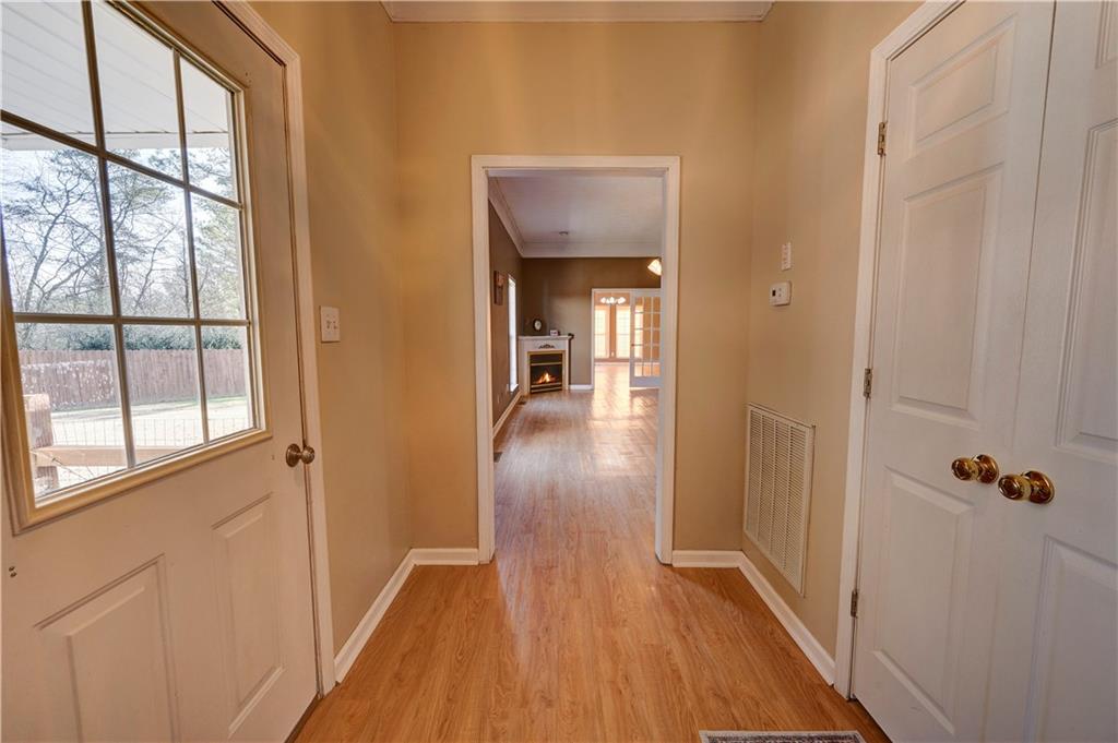 960 McEntyre Loop Calhoun, GA 30701 - Photo 3 of 77 a view of a hallway with wooden floor and a bathroom