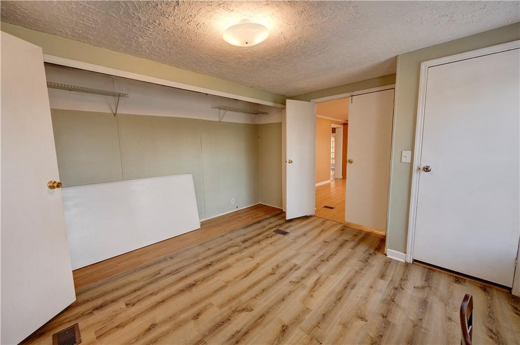 960 McEntyre Loop Calhoun, GA 30701 - Photo 32 of 77 a view of empty room with wooden floor