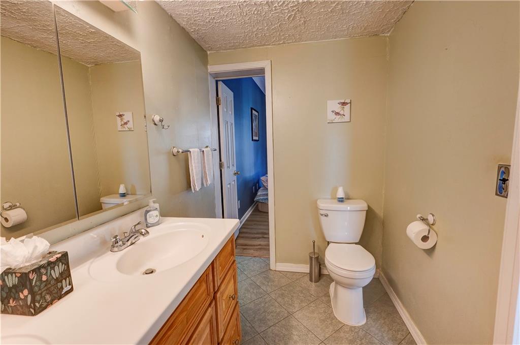 960 McEntyre Loop Calhoun, GA 30701 - Photo 37 of 77 a bathroom with a sink a toilet and shower