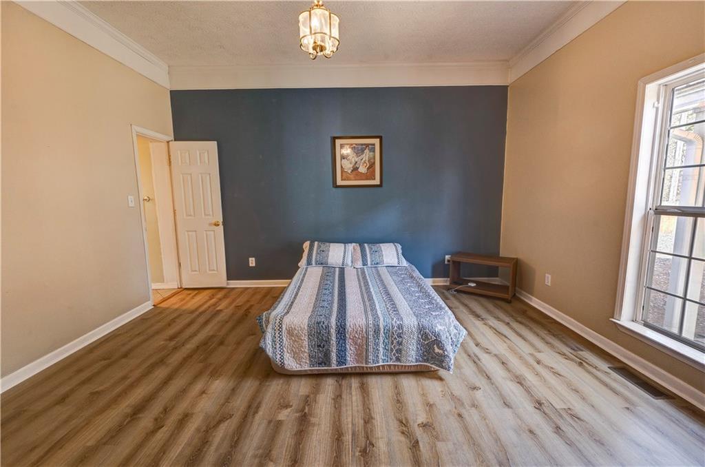 960 McEntyre Loop Calhoun, GA 30701 - Photo 38 of 77 a view of a livingroom with wooden floor and a window