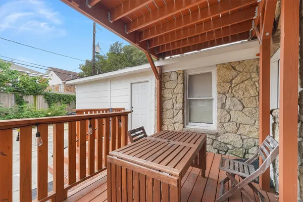 a view of a balcony with wooden floor