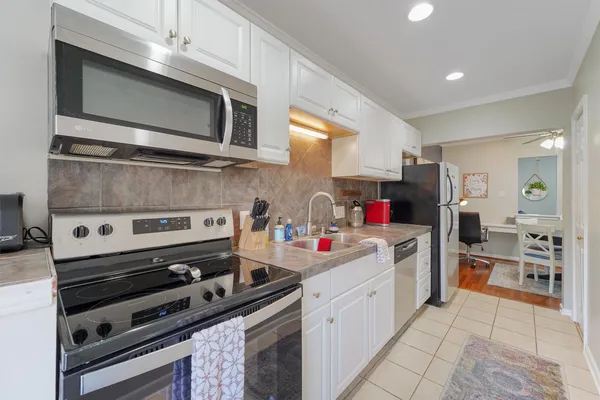a kitchen with a stove and a microwave