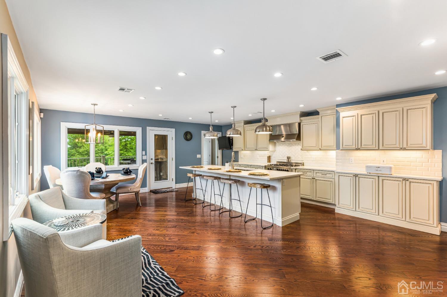 193 Mt Horeb Road Warren, NJ 07059 - Photo 29 of 63 a living room with stainless steel appliances granite countertop a couch wooden floor and a large window