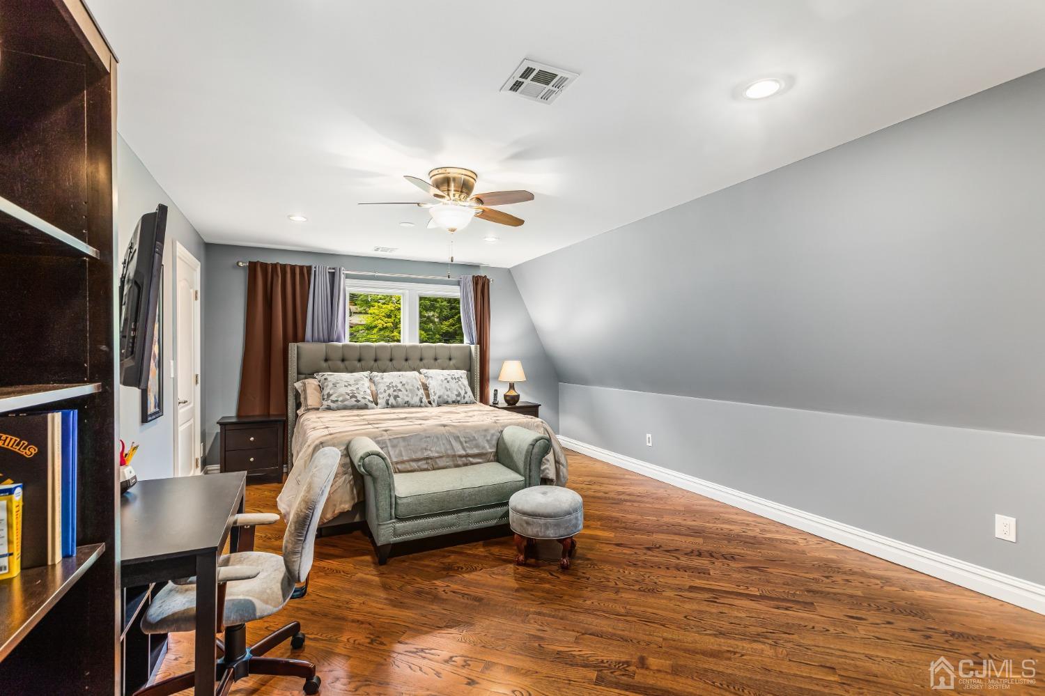 193 Mt Horeb Road Warren, NJ 07059 - Photo 49 of 63 a spacious bedroom with a bed furniture and a flat screen tv
