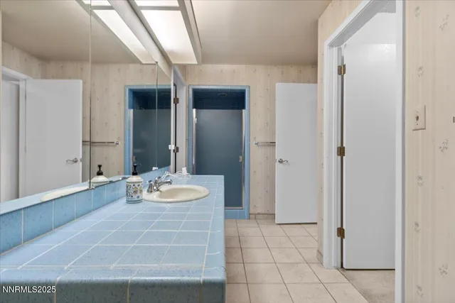 a bathroom with a sink and a mirror