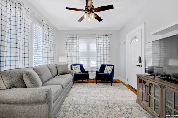 a living room with furniture and a window