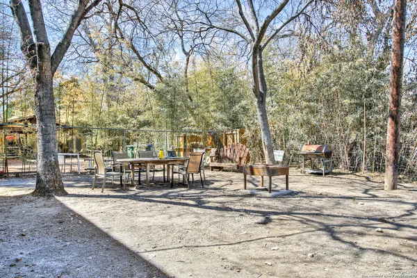 a view of park space with large trees