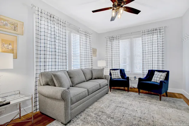 a living room with furniture and a window