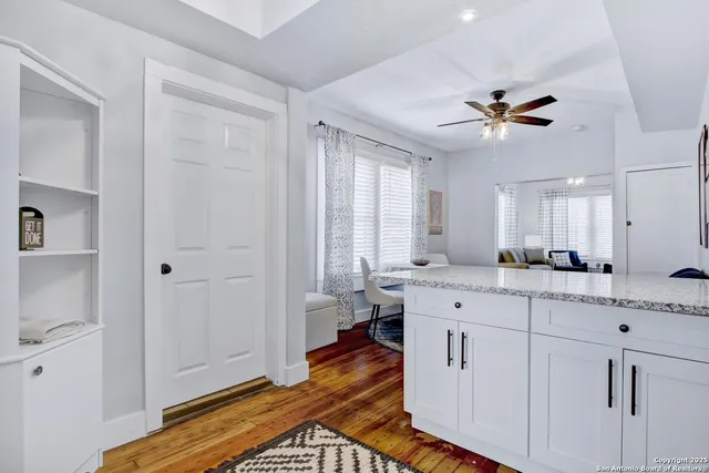 a spacious bathroom with a double vanity sink a mirror and a shower