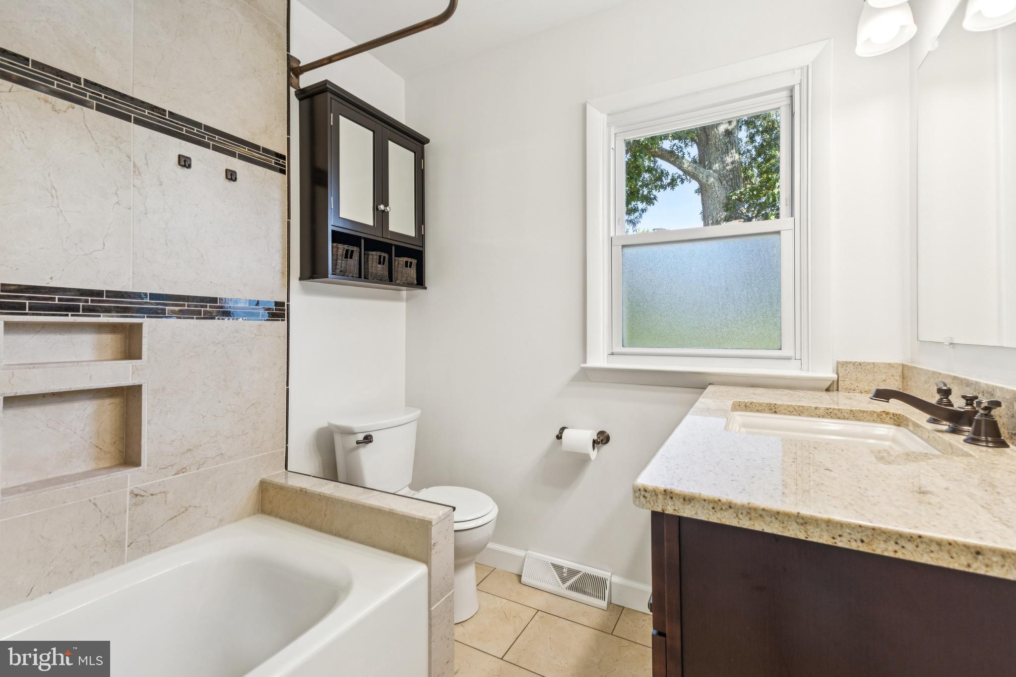 22810 Ridge Road Clarksburg, MD 20871 - Photo 18 of 44 a bathroom with a sink and a bathtub