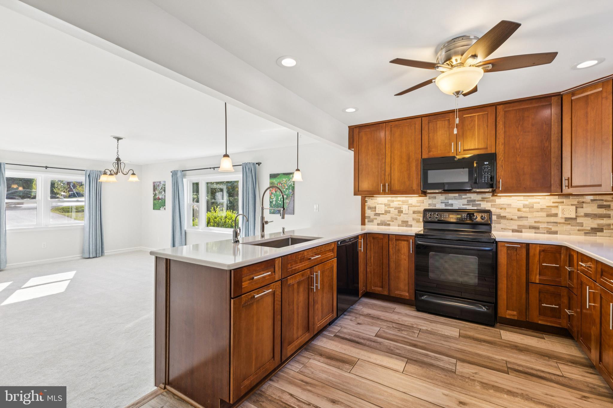 22810 Ridge Road Clarksburg, MD 20871 - Photo 2 of 44 a kitchen with stainless steel appliances granite countertop a stove and a sink