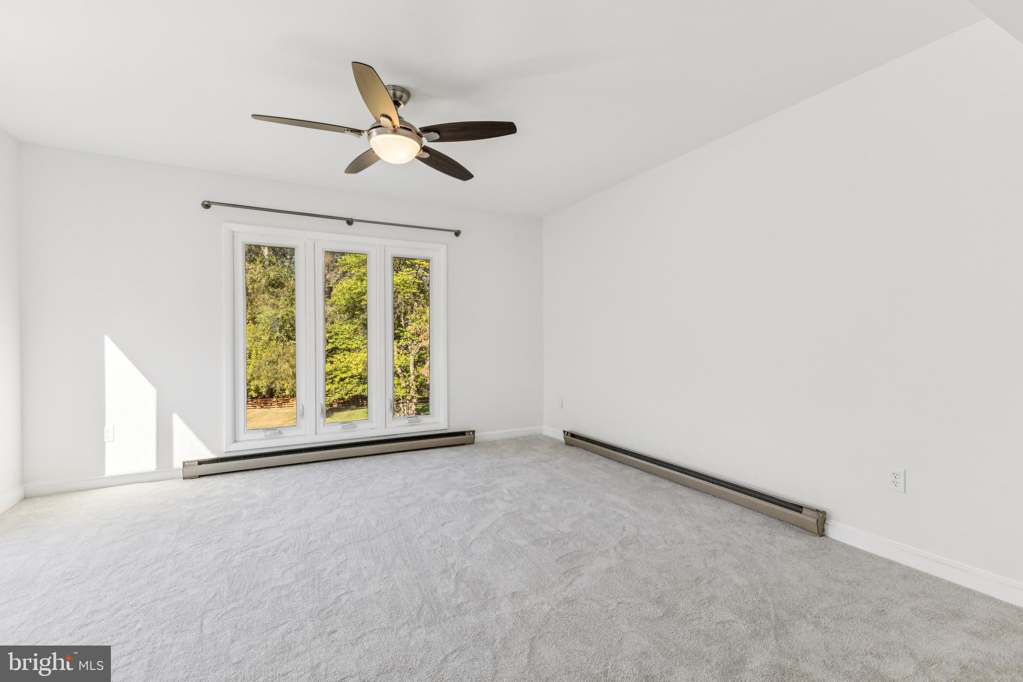 22810 Ridge Road Clarksburg, MD 20871 - Photo 23 of 44 an empty room with ceiling fan and window