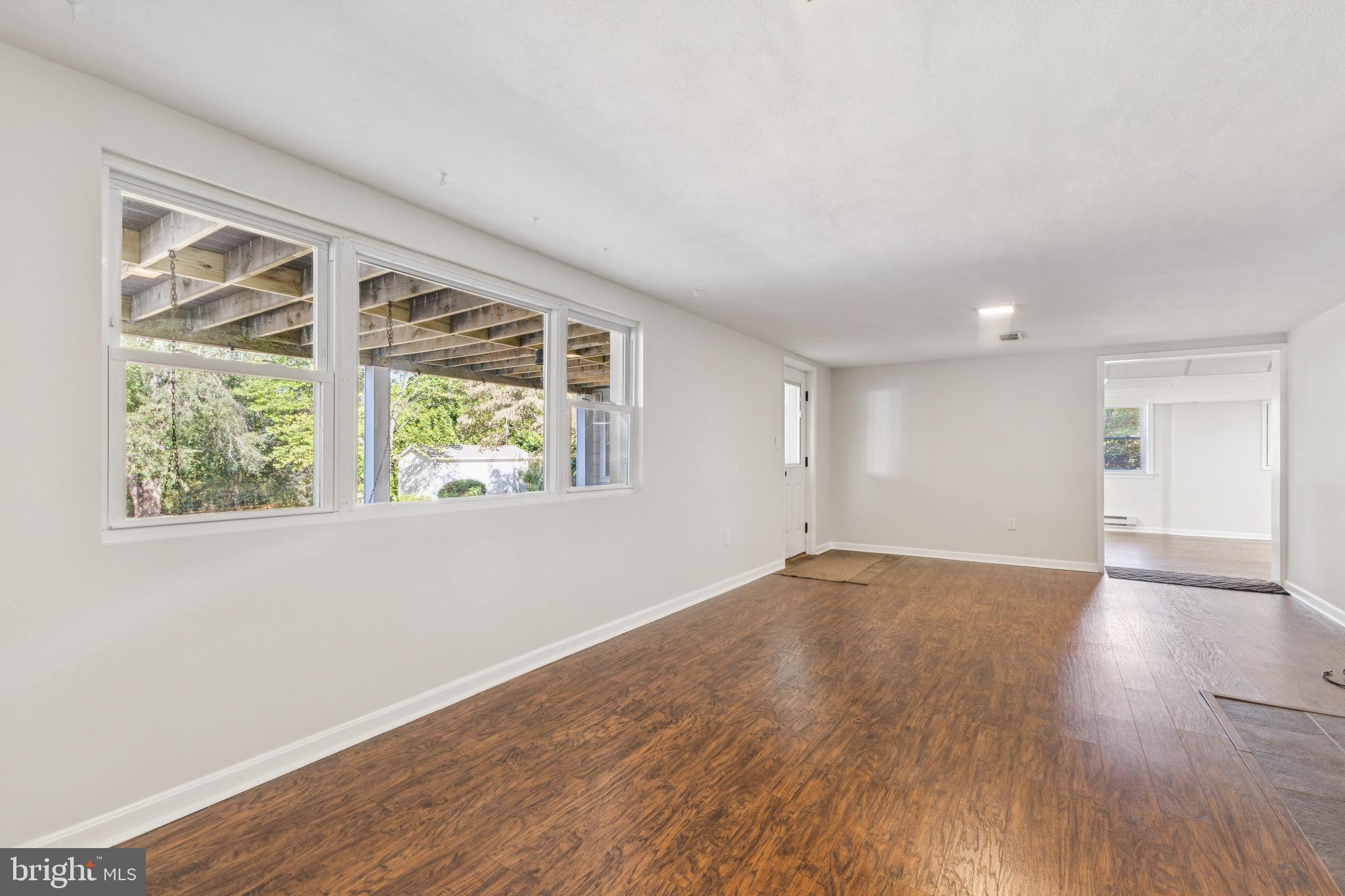 22810 Ridge Road Clarksburg, MD 20871 - Photo 27 of 44 an empty room with wooden floor and windows