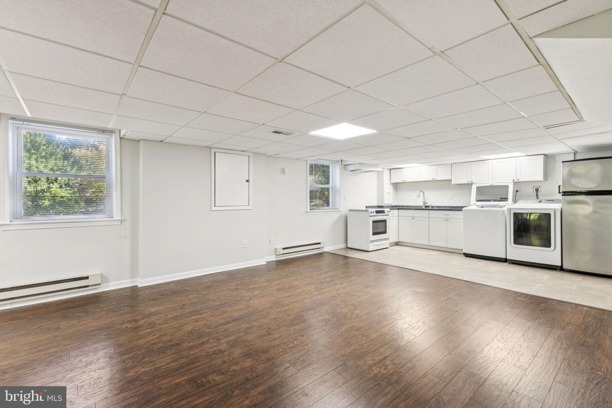 22810 Ridge Road Clarksburg, MD 20871 - Photo 29 of 44 a view of a kitchen with wooden floor and electronic appliances