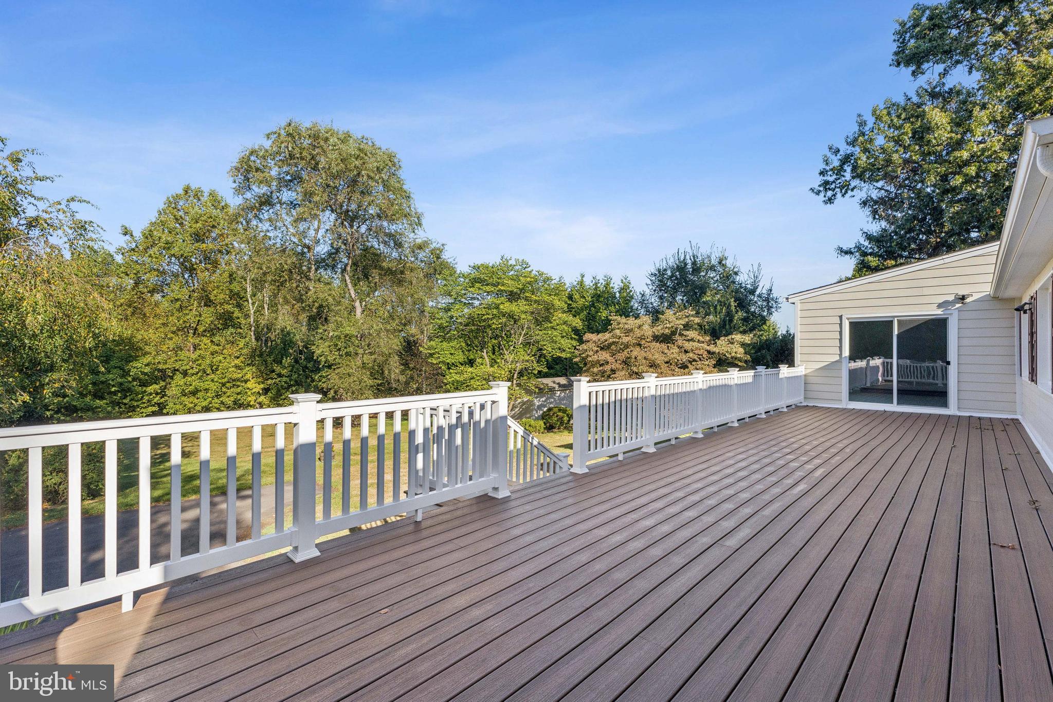 22810 Ridge Road Clarksburg, MD 20871 - Photo 34 of 44 a view of a wooden deck with a yard