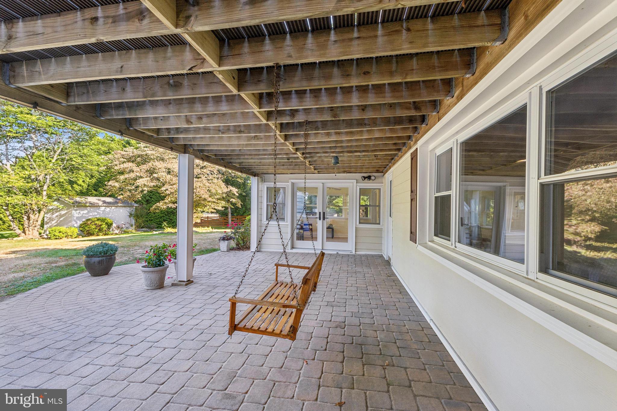 22810 Ridge Road Clarksburg, MD 20871 - Photo 37 of 44 a view of a porch with furniture and garden