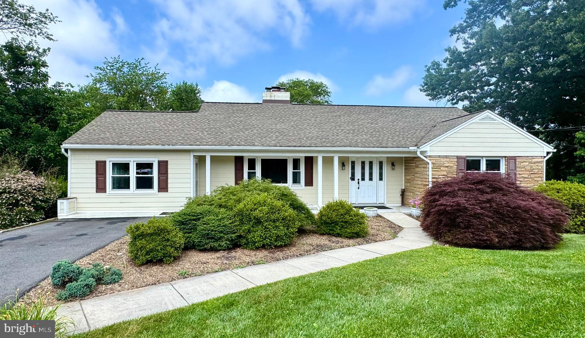 22810 Ridge Road Clarksburg, MD 20871 - Photo 40 of 44 a front view of a house with a garden