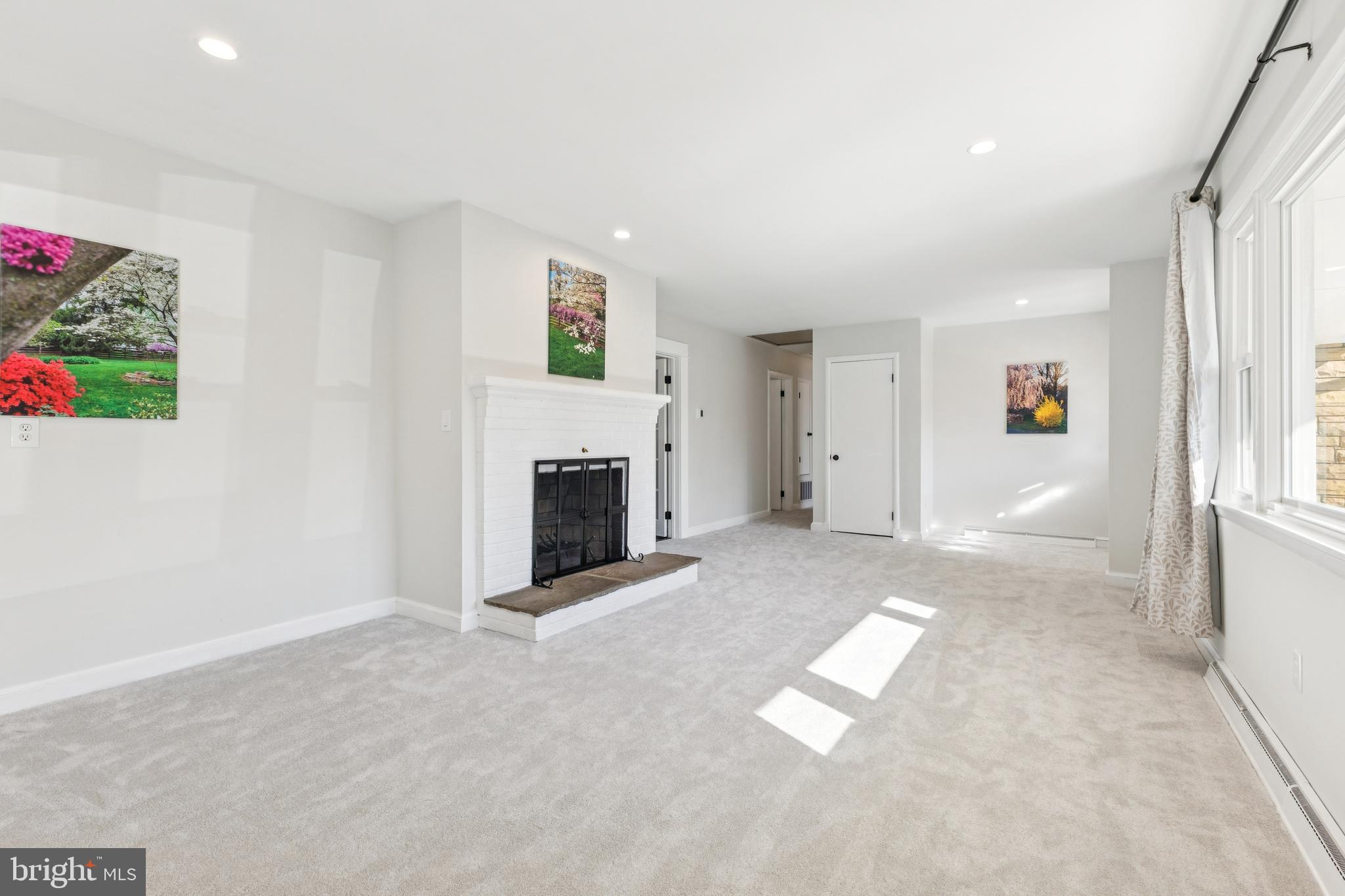 22810 Ridge Road Clarksburg, MD 20871 - Photo 5 of 44 an empty room with windows and fireplace