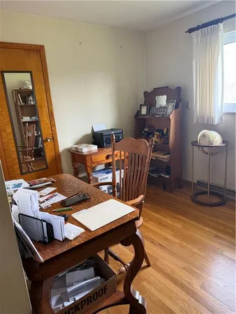 a workspace with furniture and window