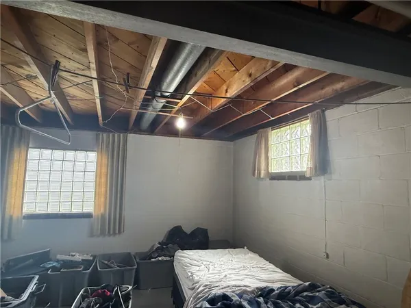 a utility room with wooden floor
