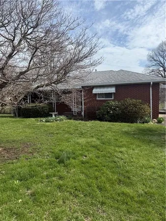 a view of house with garden