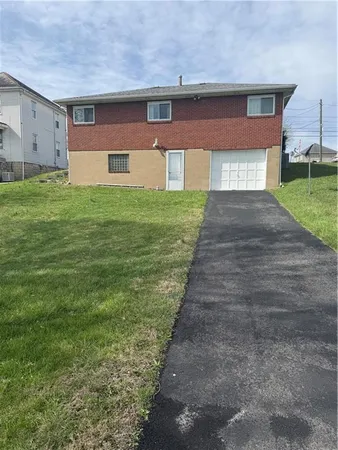 a brick building with a yard