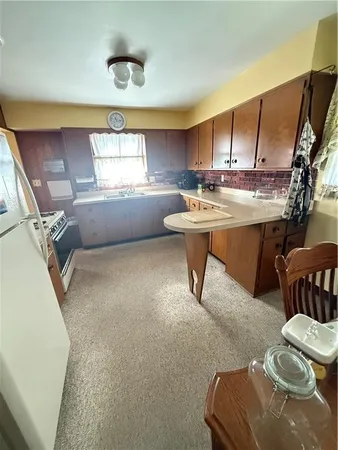 a room with a chair a table and chairs