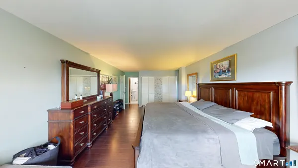 a bed room with furniture and wooden floor