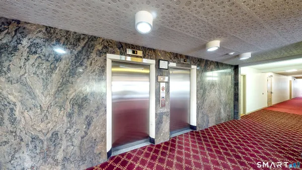 a bathroom with a mirror and a shower
