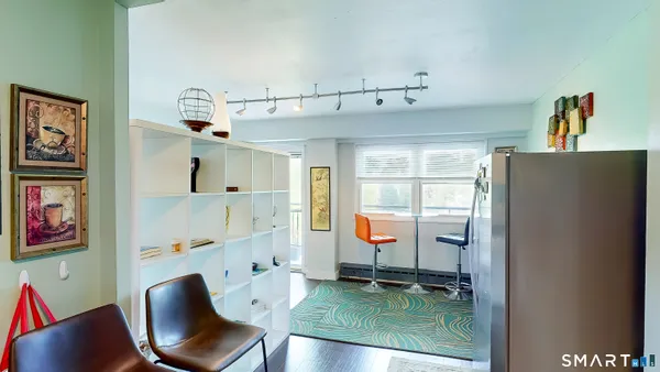 a workspace with furniture and window