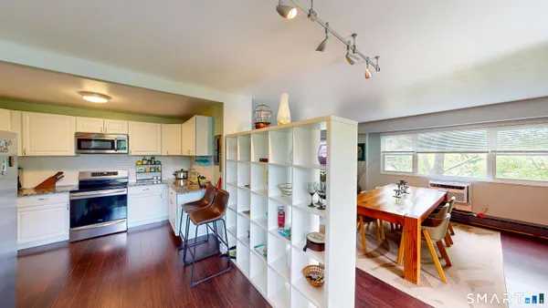 a view of a kitchen with furniture and a window