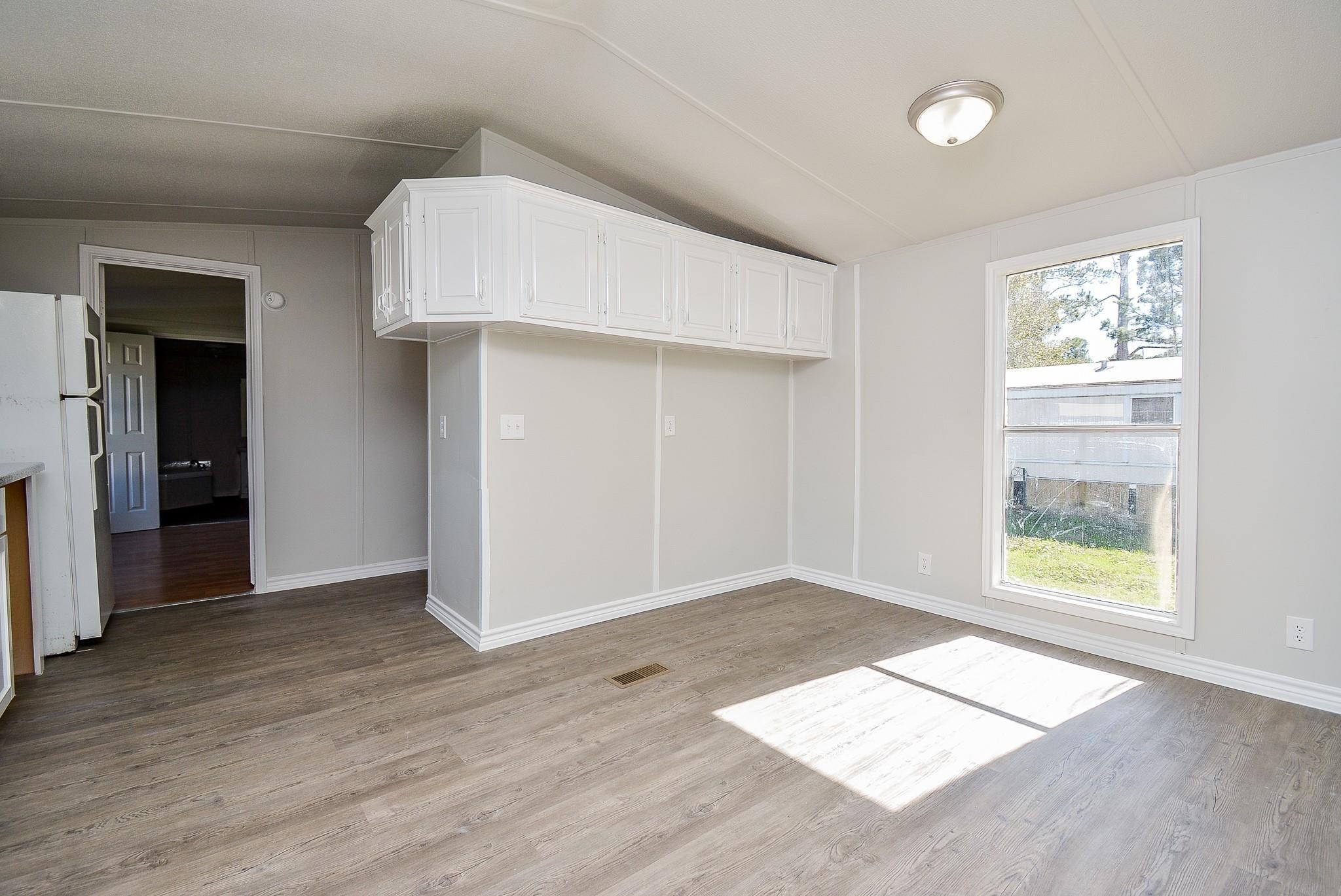 12561 Roy Harris Loop Conroe, TX 77306 - Photo 13 of 31 an empty room with windows and closet