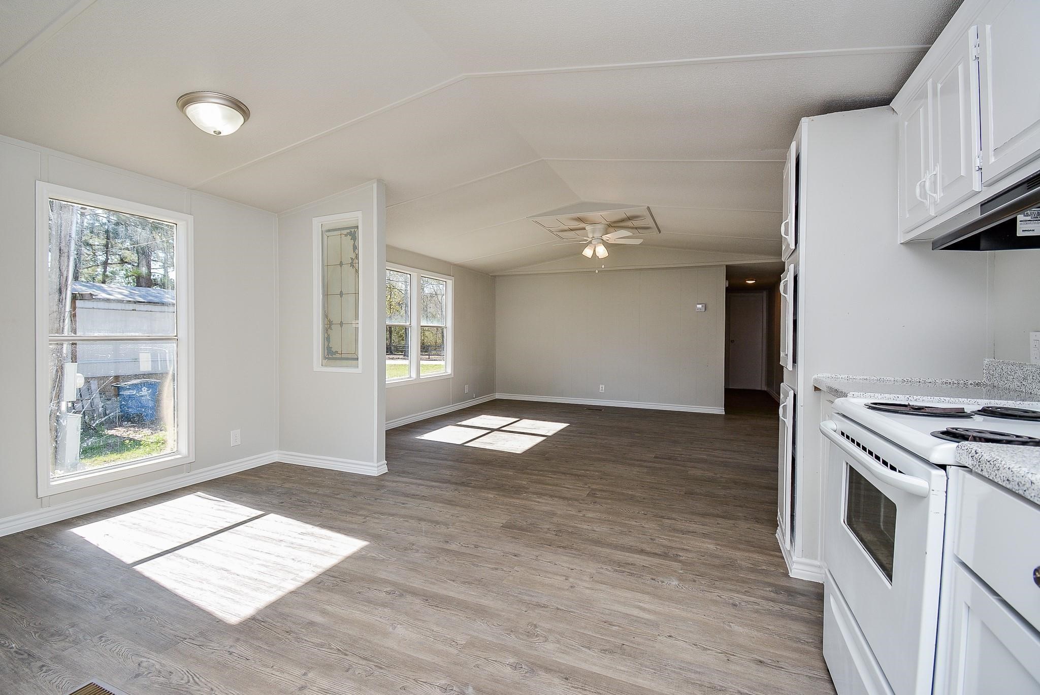 12561 Roy Harris Loop Conroe, TX 77306 - Photo 15 of 31 a view of workspace with wooden floor and window