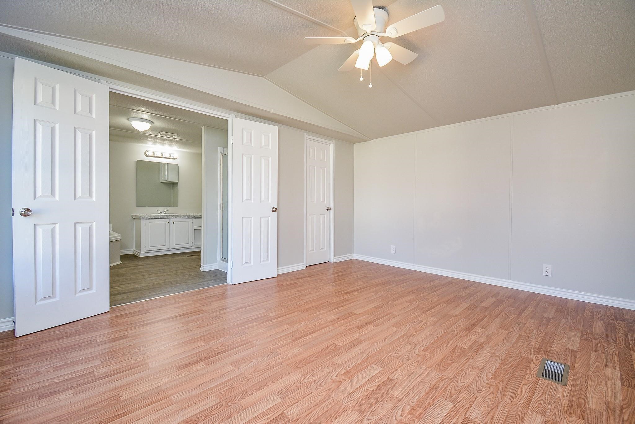 12561 Roy Harris Loop Conroe, TX 77306 - Photo 17 of 31 a view of empty room with wooden floor