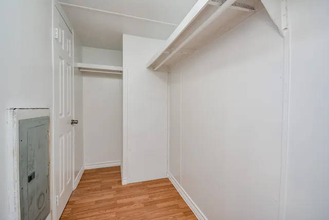a view of a room with wooden floor