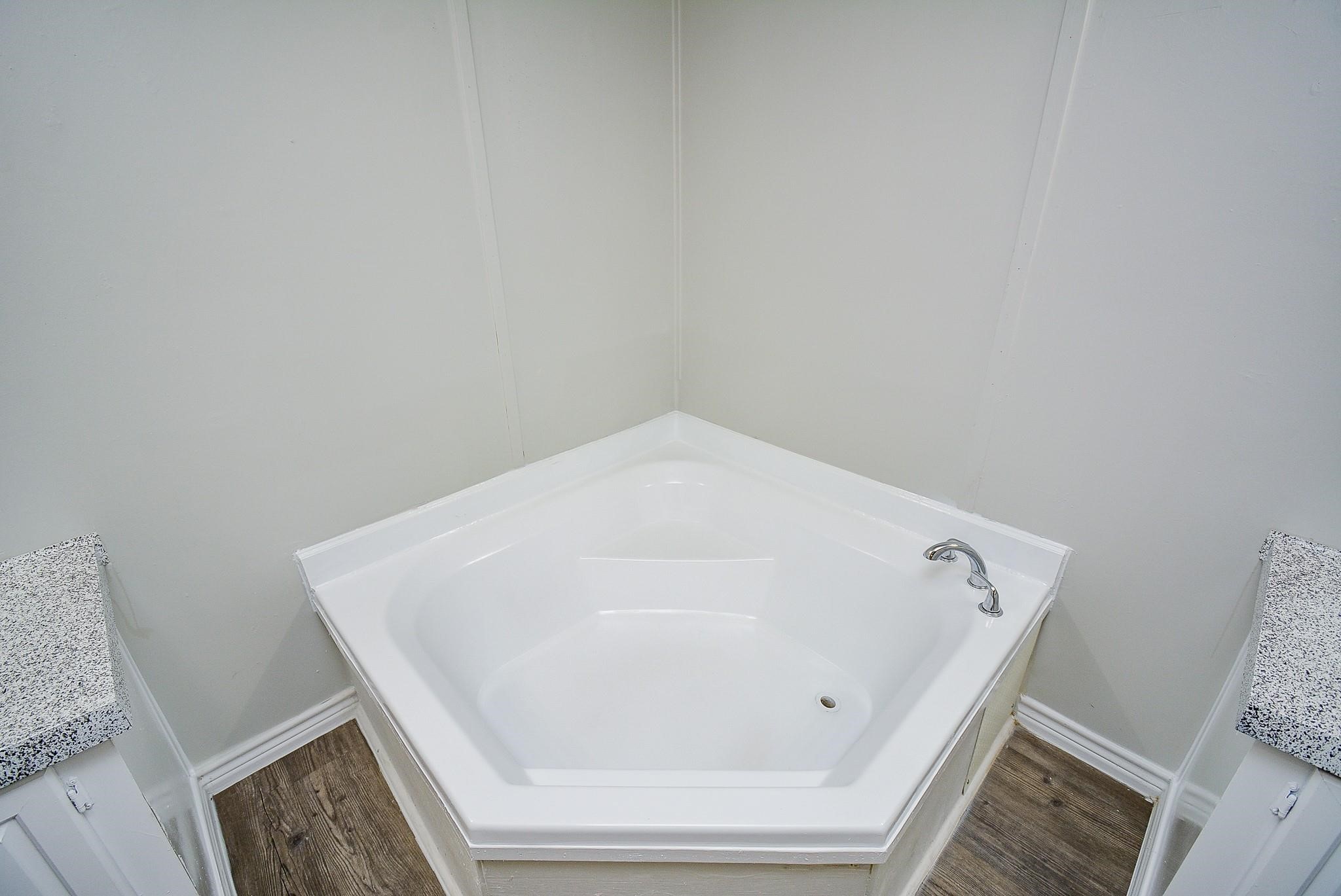 12561 Roy Harris Loop Conroe, TX 77306 - Photo 30 of 31 a bathroom with a bathtub