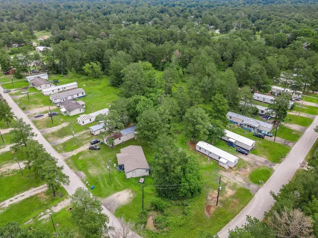 an aerial view of residential houses with outdoor space