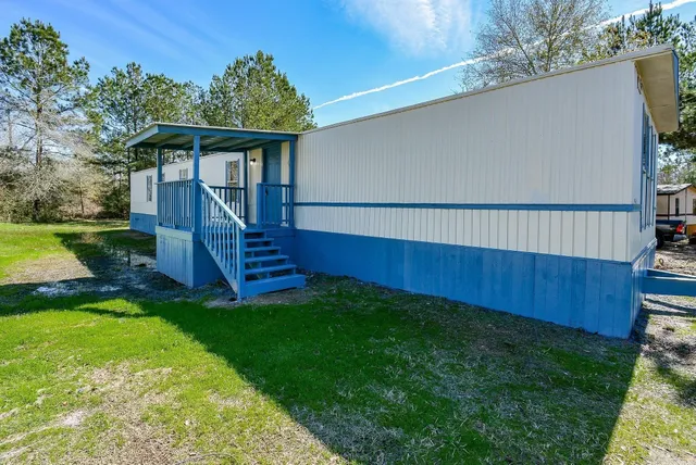a view of a deck with a yard