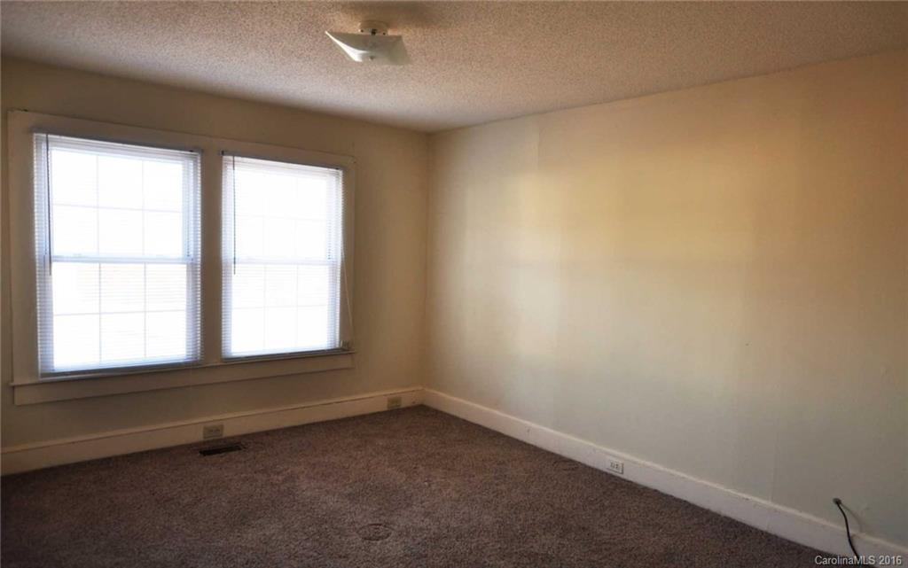 5249 Clearwater Lake Road Mount Holly, NC 28120 - Photo 2 of 16 an empty room with a window