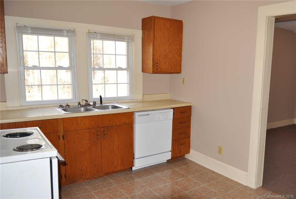 5249 Clearwater Lake Road Mount Holly, NC 28120 - Photo 13 of 16 a utility room with sink dryer and washer