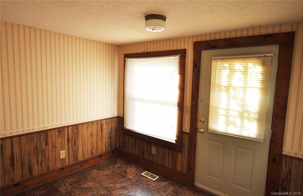 5249 Clearwater Lake Road Mount Holly, NC 28120 - Photo 3 of 16 a view of an empty room with a window