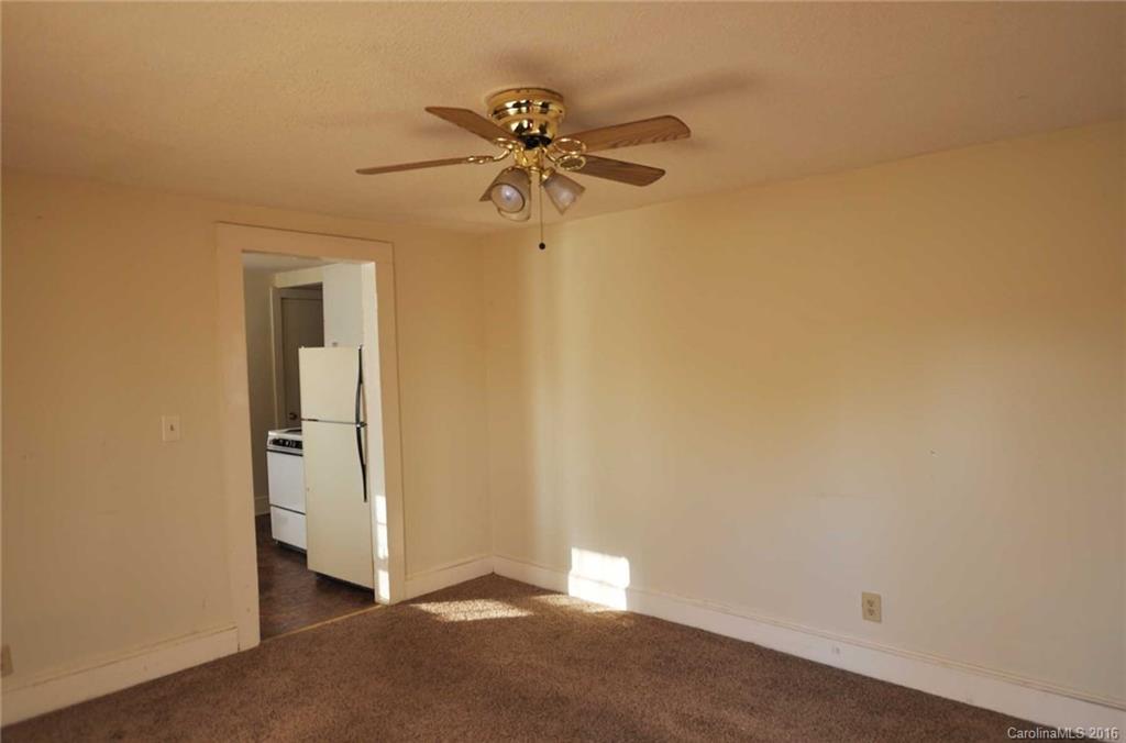5249 Clearwater Lake Road Mount Holly, NC 28120 - Photo 4 of 16 a view of a hallway with a fan