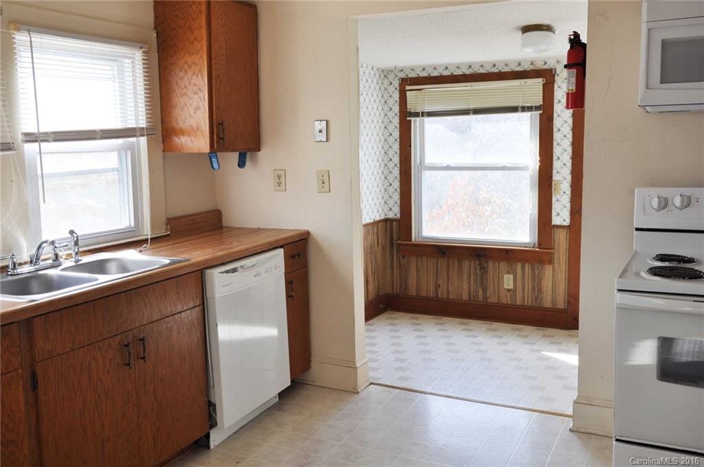 5249 Clearwater Lake Road Mount Holly, NC 28120 - Photo 7 of 16 a kitchen with a sink cabinets and a window