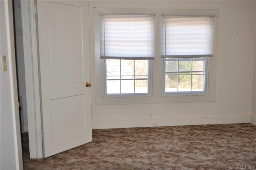 5249 Clearwater Lake Road Mount Holly, NC 28120 - Photo 9 of 16 a view of an empty room with a window