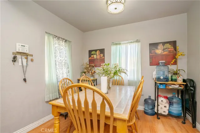 a view of a dining room with furniture and window