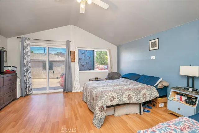 a bedroom with two beds and a chandelier