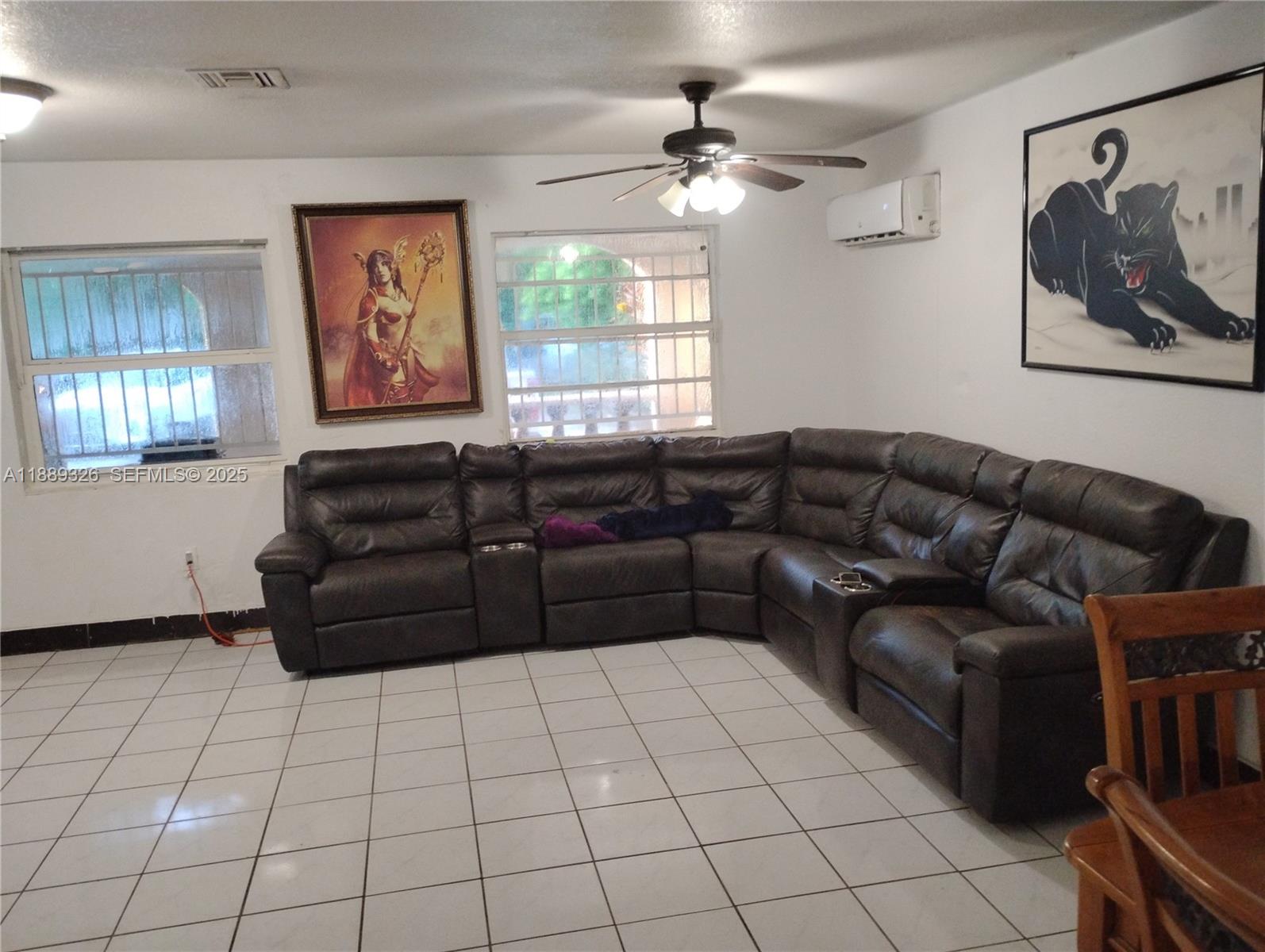19755 Southwest 190th Street Miami, FL 33187 - Photo 11 of 17 a living room with furniture and a window