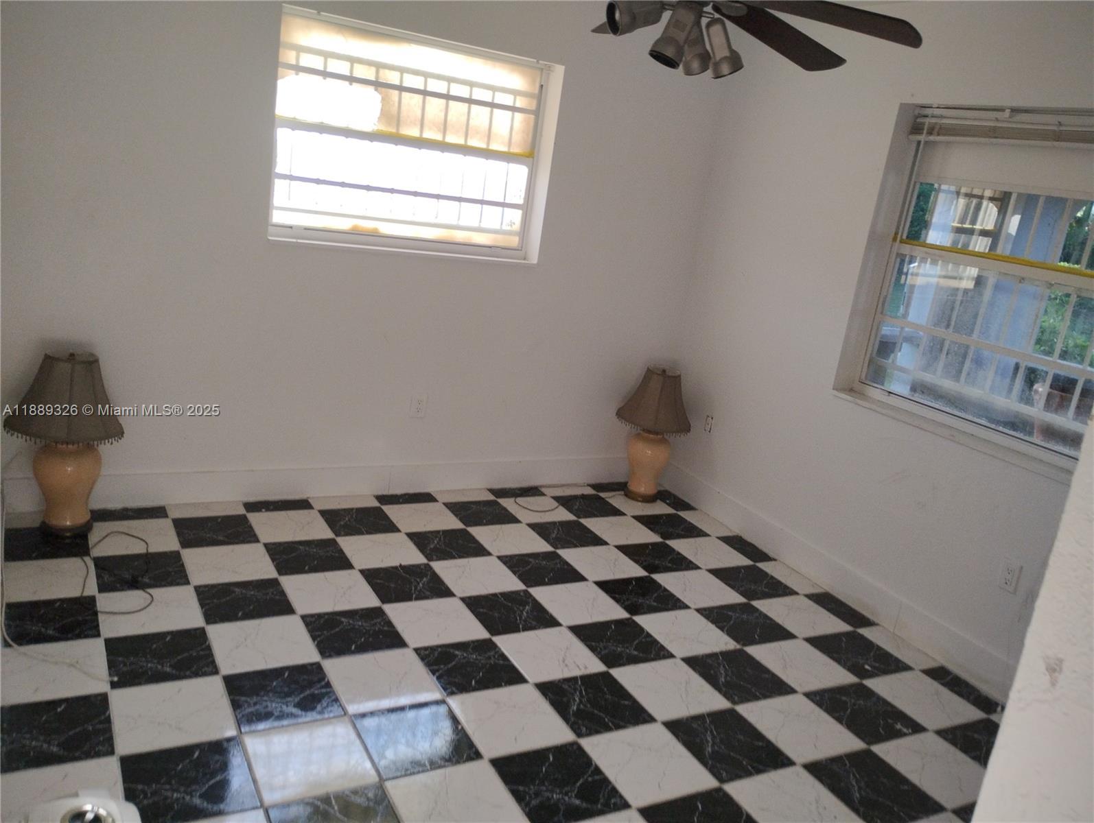 19755 Southwest 190th Street Miami, FL 33187 - Photo 12 of 17 a black and white checkered floor